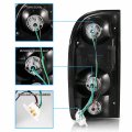 Amerilite Black Replacement Tail Lights For 95-00 Toyota Tacoma Pickup Truck- Passenger And Driver Side Bulb Harness Included